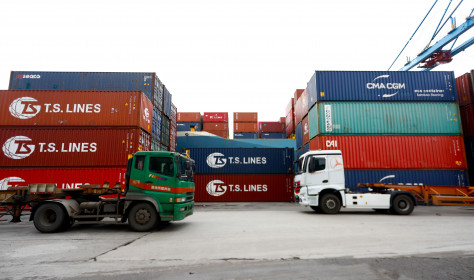 Cargoes and transport long vehicles are seen at a port in Keelung.