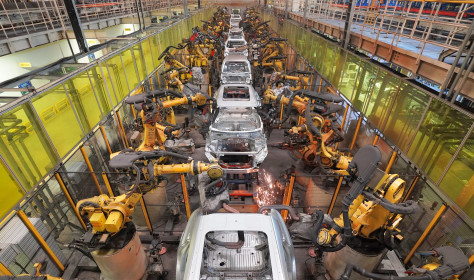 Robots work on a vehicle assembly line in east China's Shandong province