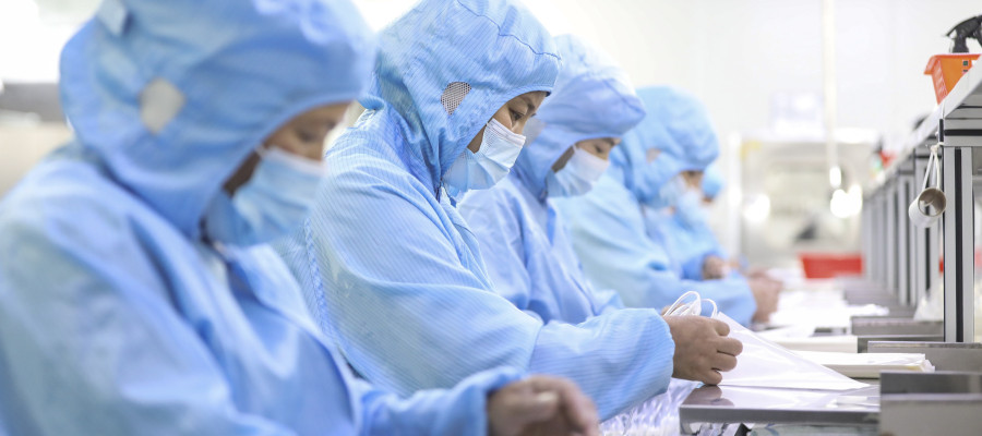 Workers make medical infusion sets for export at a workshop in Huai 'an City, Jiangsu Province, China