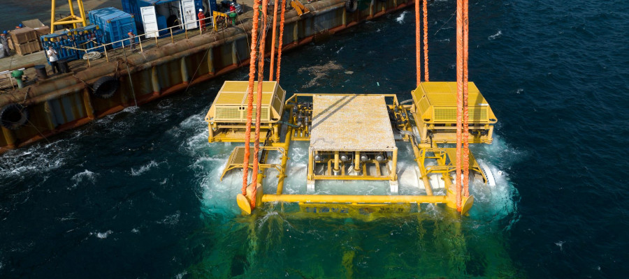 A drone photo taken on Feb. 18, 2025 shows Hainan's commercial underwater intelligent computing cluster being lowered into the sea near Lingshui Li Autonomous County in south China's Hainan Province