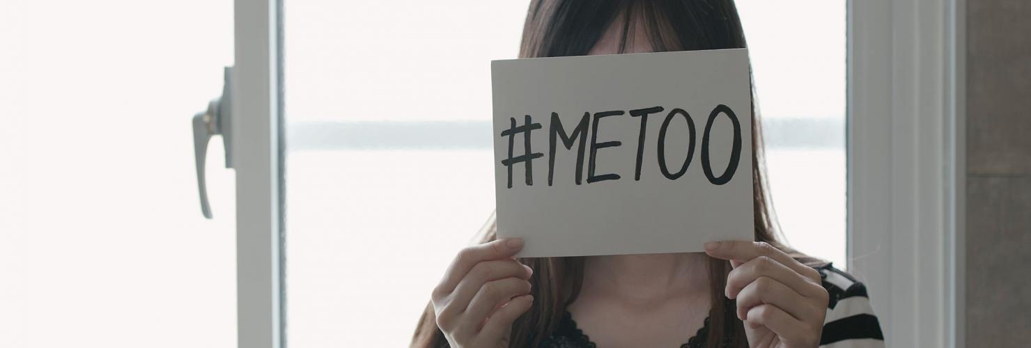 Asian girl holding a #MeToo sign