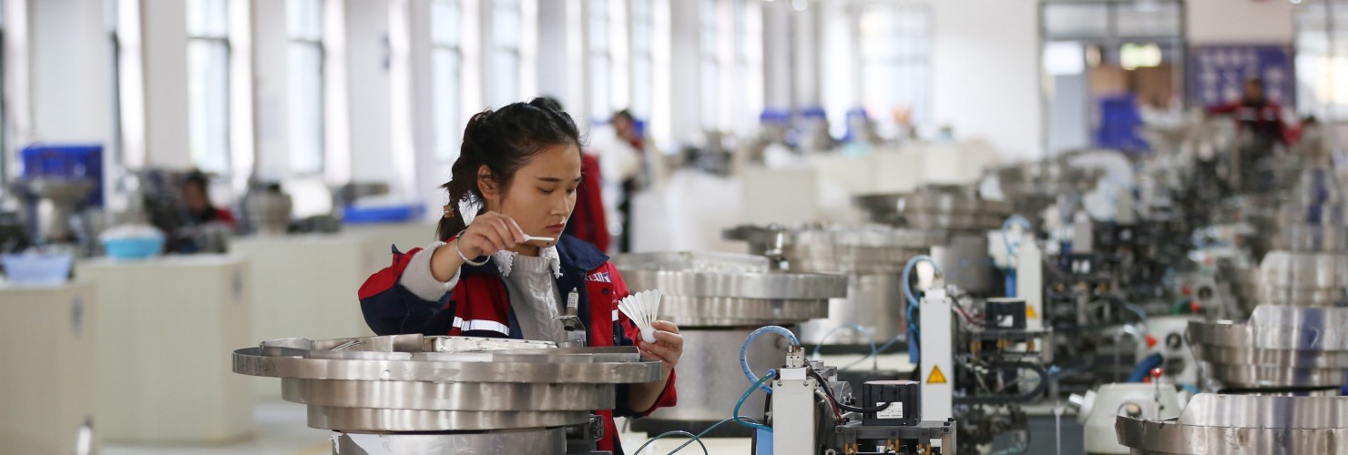 A worker assembles a badminton ball in a production base in Jinping County, Guizhou Province.