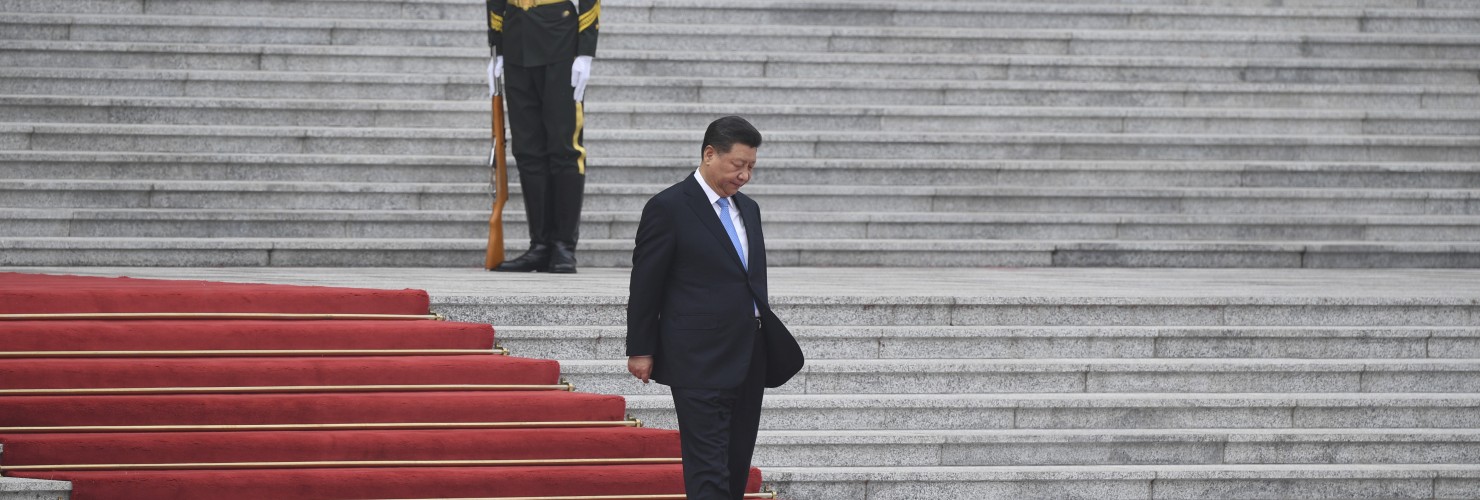 Xi Jinping walks down steps at the Great Hall of the People