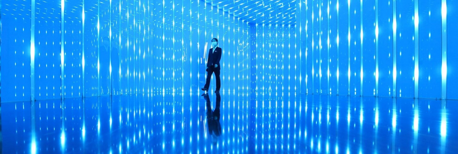 An employee walks at an exhibition hall for the Chongqing New Type Internet of Things (IoT) Big Data Service Platform for Digital Transportation at a branch of Chongqing City Construction Investment