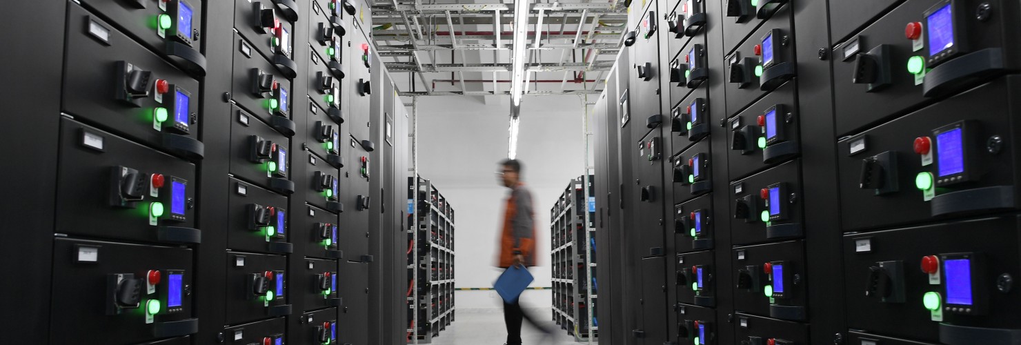 A worker maintains equipments at a cloud computing base under construction in Zhongwei City