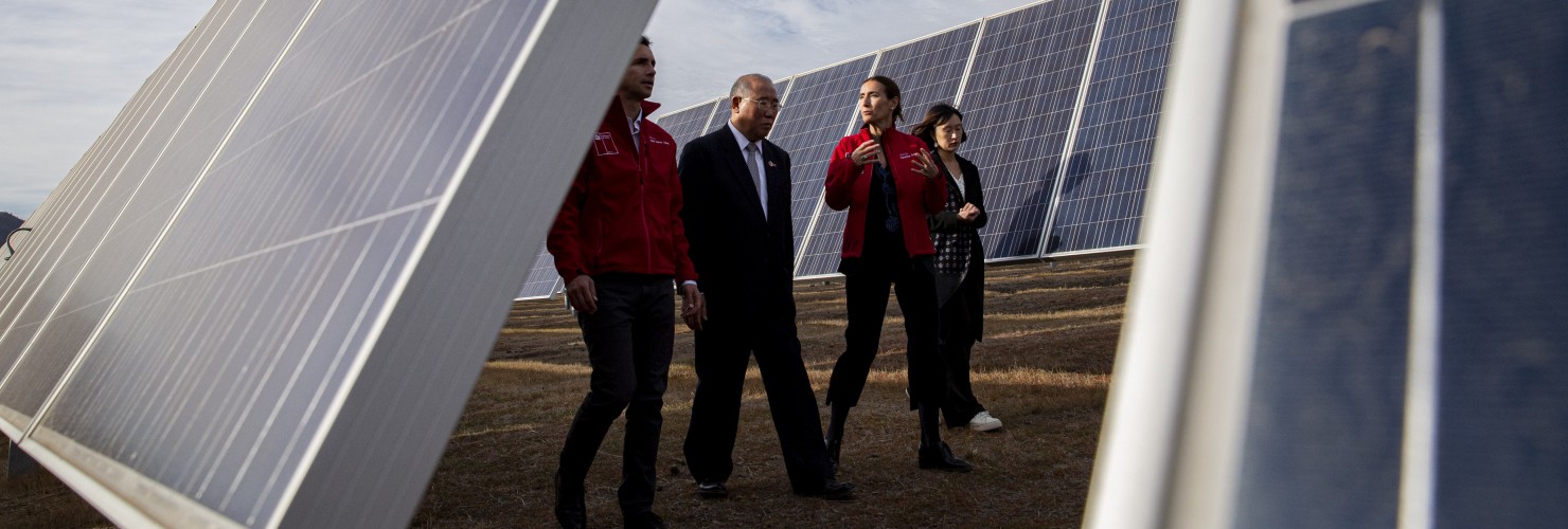 China's Xie Zhenhua, second from left, walks with Chile's Environment Minister Carolina Schmidt, third from left, and Chile's Energy Minister Juan Carlos Jobet, far left, as they tour the Quilapilún solar plant, a joint venture by China and Chile, in Colina, Chile, Tuesday, Aug. 20, 2019.
