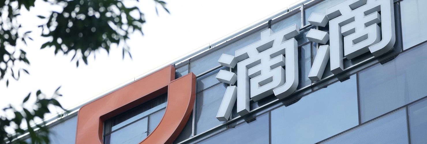 The Didi logo is seen at the top of its headquarters building in Beijing.