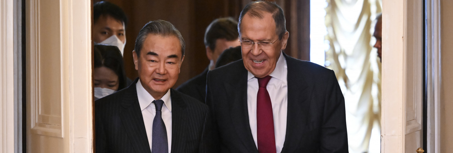 Russian Foreign Minister Sergey Lavrov, right, and the Chinese Communist Party's foreign policy chief Wang Yi enter a hall for their talks in Moscow, Russia, Wednesday, Feb. 22, 2023. 