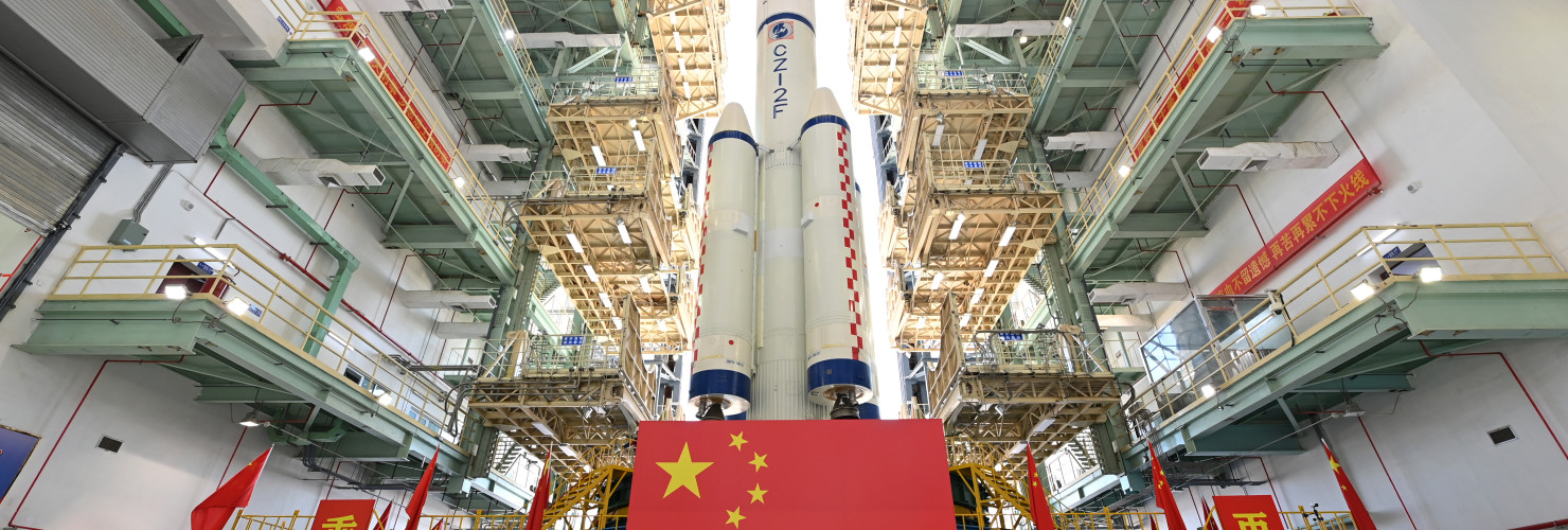Shenzhou-19 crewed spaceship and a Long March-2F carrier rocket being transferred to the launch area.