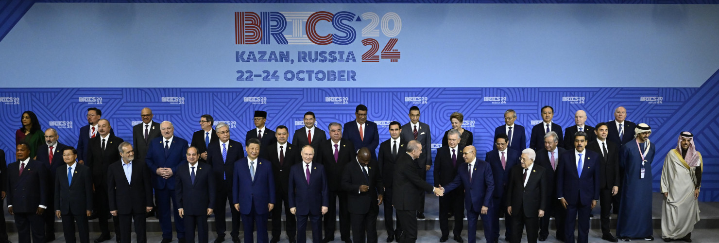 Turkish President Recep Tayyip Erdogan greets the leaders as they take part in the family photo taken at the 16th BRICS Summit in Kazan, Russia on October 24, 2024.