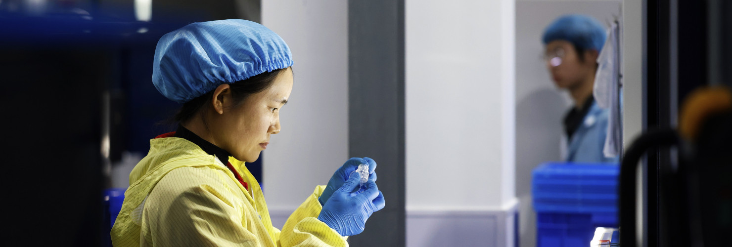  A worker produces new materials for high-end special-shaped anti-counterfeiting bottle caps at a workshop of Sihong Economic Development Zone in Suqian, Jiangsu province, China, November 13, 2024.