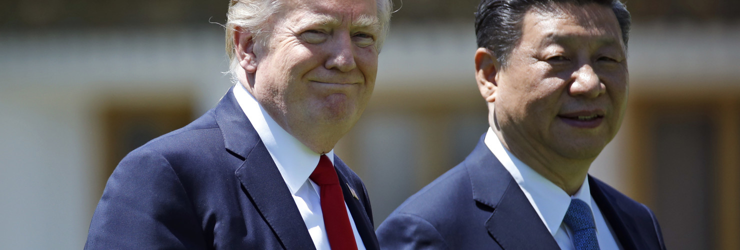In this April 7, 2017, file photo President Donald Trump and Chinese President Xi Jinping walk together after their meetings at Mar-a-Lago.