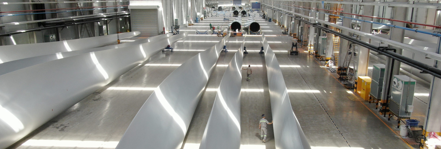 Employees inspect wind turbine blades at a workshop of Shanghai Aeolon Wind Energy Technologies Development (Group) Co Ltd. on May 13, 2020 in Nantong, Jiangsu Province of China.