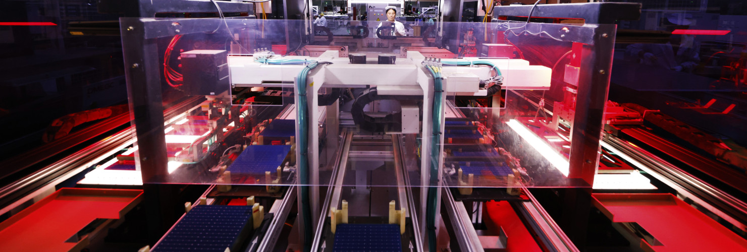 A worker is producing photovoltaic modules for export at a 5G smart workshop of a new energy company in Suqian, Jiangsu province, China, September 3, 2024.