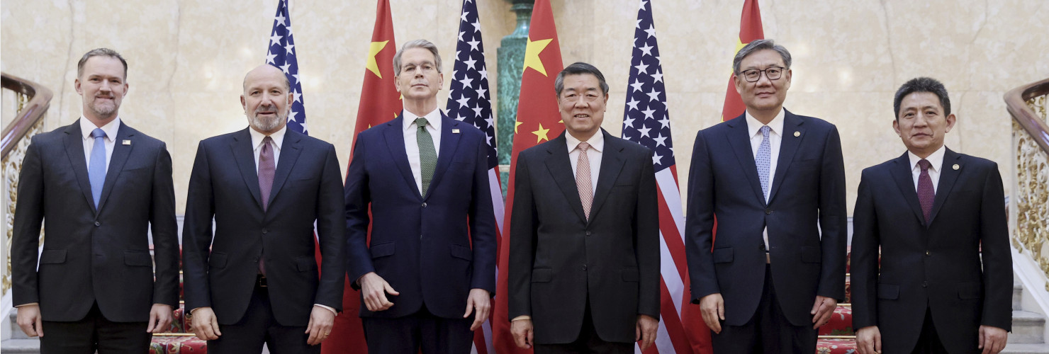 In this photo released by Xinhua News Agency, Chinese Vice Premier He Lifeng, center right, and U.S. Treasury Secretary Scott Bessent, center left, pose for a group photo with delegations before their meeting to discuss China-U.S. trade, in London, Monday, June 9, 2025.