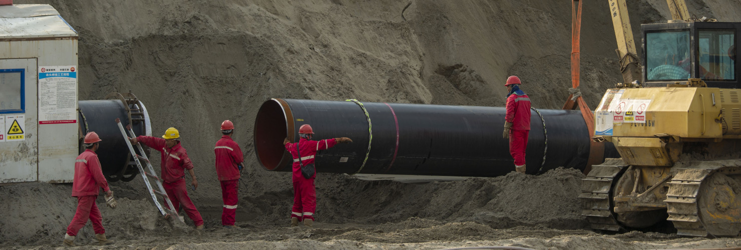 Workers labor at the construction site of the China-Russia east route natural gas pipeline in Hai'an in eastern China's Jiangsu province Saturday, March 12, 2022.