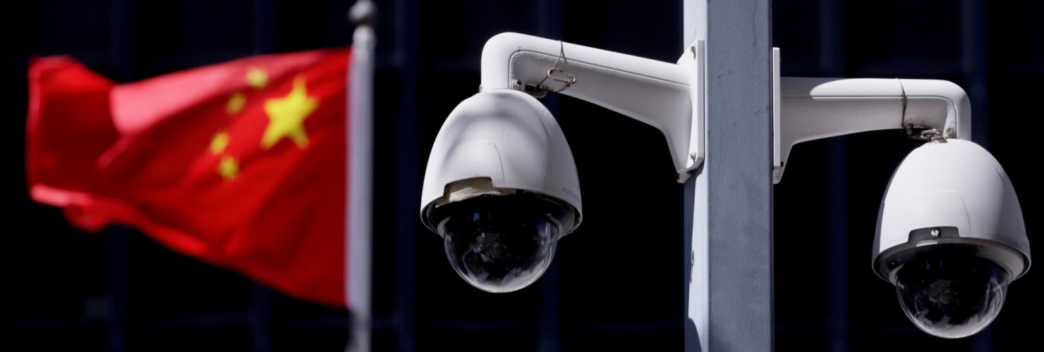 Security cameras in front of a Chinese flag