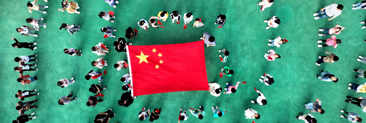 Kindergarten children pose with national flags in Lianyungang, Jiangsu province, China.