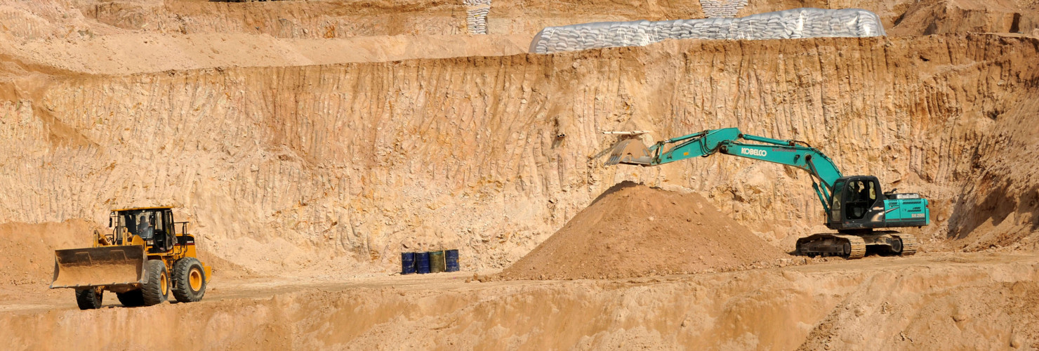 Workers use machinery to dig at a rare earth mine in Ganxian county in central China's Jiangxi province on Dec. 30, 2010.