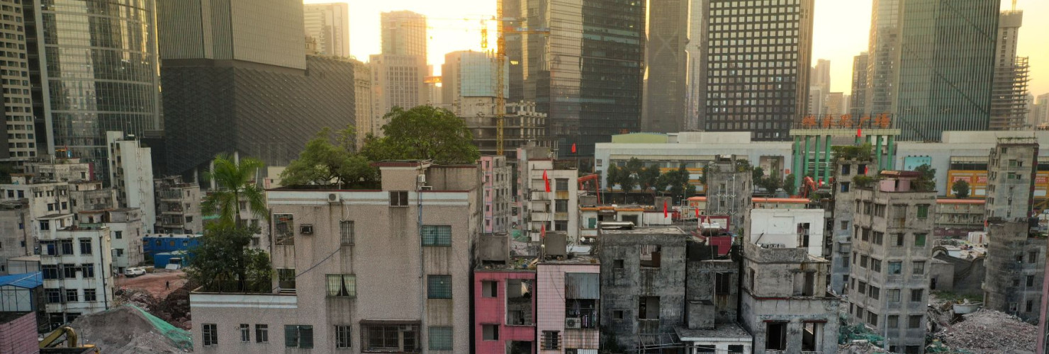 A sharp contrast between Xian village and skyscrapers around in Guangzhou city, south China's Guangdong province.