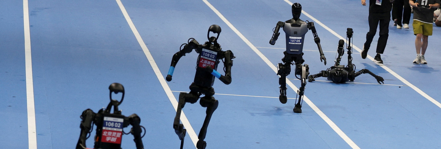 Unitree Robotics and Tiangong humanoid robots compete in the 100m final at the inaugural World Humanoid Robot Games, at the National Speed Skating Oval in Beijing, China August 17, 2025