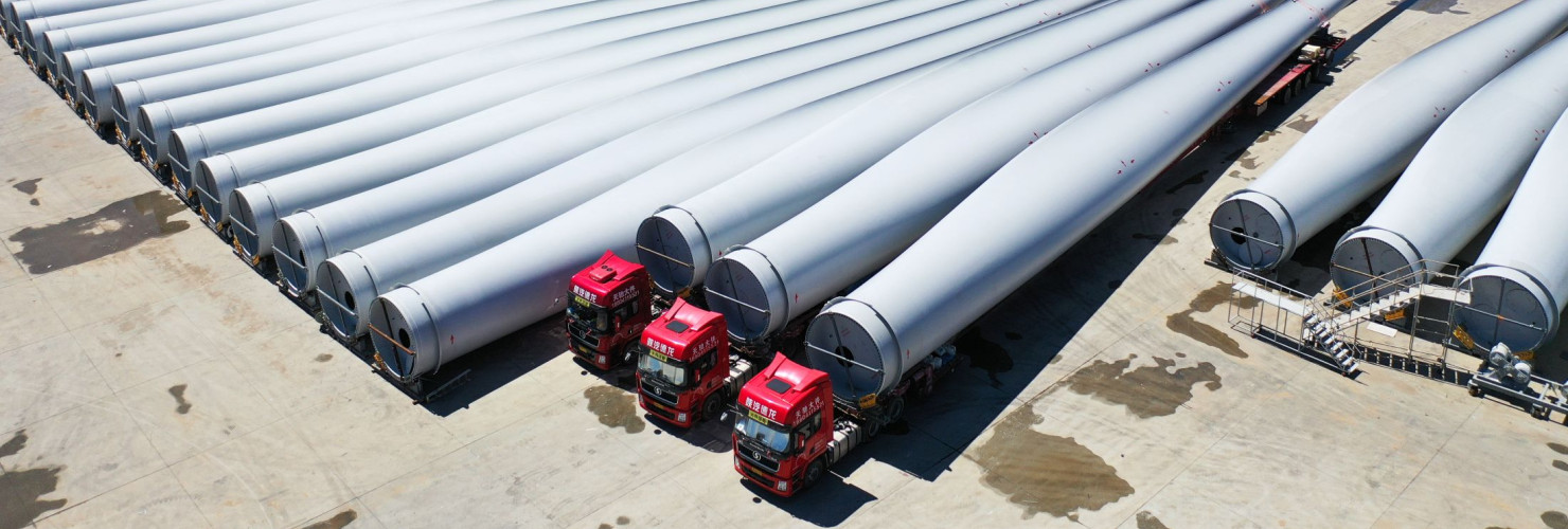 A drone photo shows wind turbine blades at the Mingyang New Energy Intelligent Manufacturing Industrial Park in Baotou, north China's Inner Mongolia Autonomous Region, July 29, 2025.