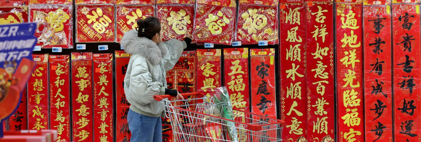 A Chinese consumer is shopping for spring couplets at a supermarket in Zaozhuang City, Shandong Province, China on January 9, 2026