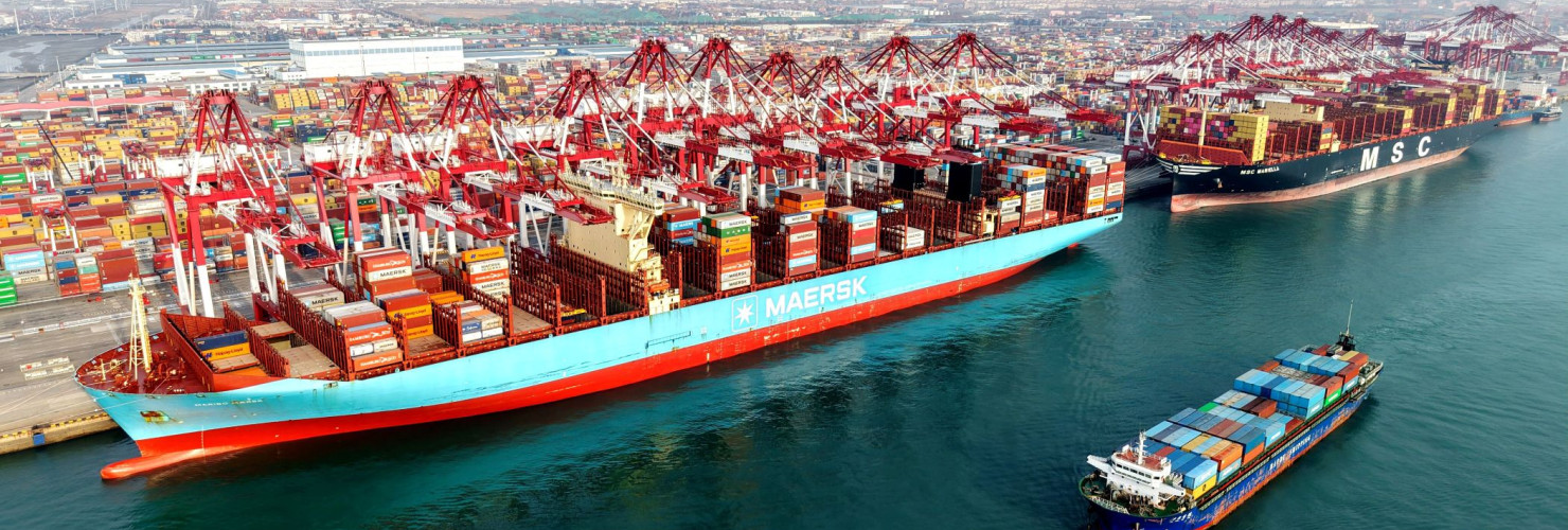 A cargo ship is loading and unloading foreign trade containers at the Qingdao Port Automated Terminal in Shandong Province, China on January 14, 2026