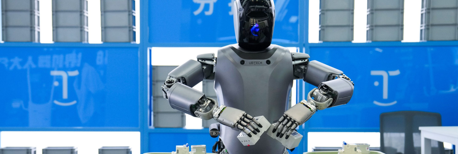 A humanoid robot from "Walker" series of UBTECH conducts sorting work at the Beijng World of Robots in Beijing
