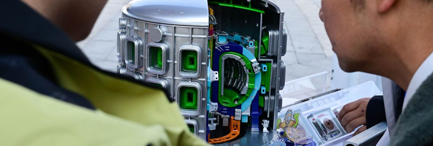 People view a model of the Burning Plasma Experimental Superconducting Tokamak (BEST)