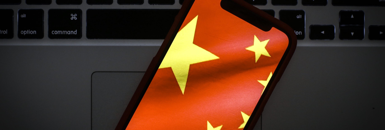 The Chinese flag is seen on a portable mobile device in this photo illustration 