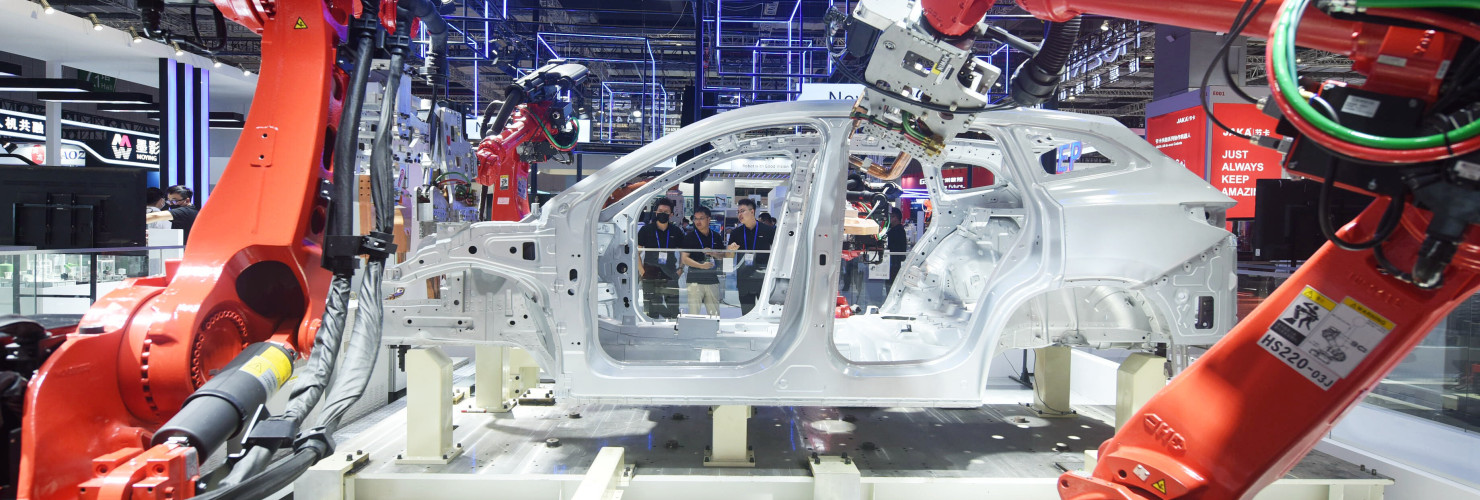 Robots make cars at the China International Industrial Expo in Shanghai