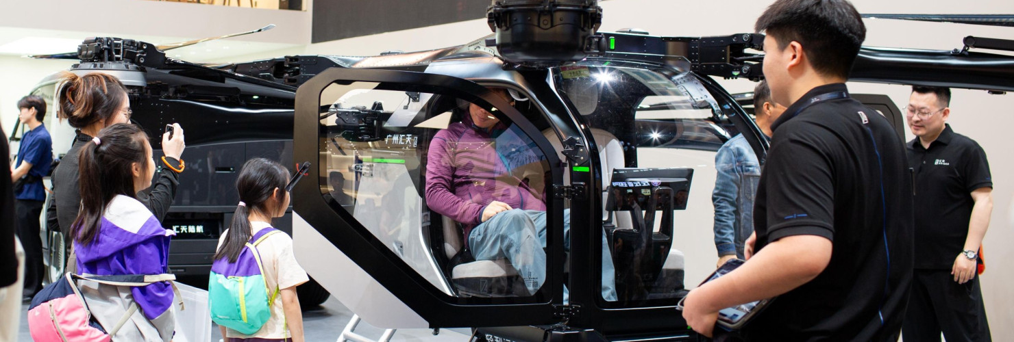 Visitors check out the cockpit section of Xpeng Aeroht's modular flying car 'Land Aircraft Carrier' at the 2026 Beijing Auto Show in Beijing, 28 April, 2026.
