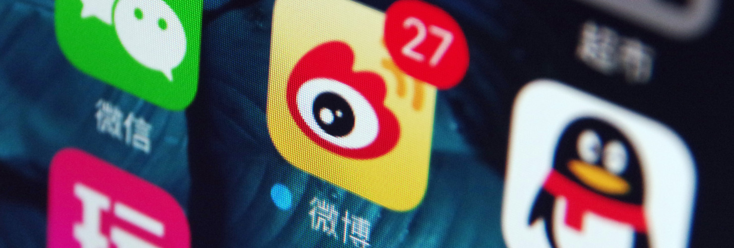 Icons of the messaging apps Weixin (WeChat), left, QQ, right, and Weibo, center