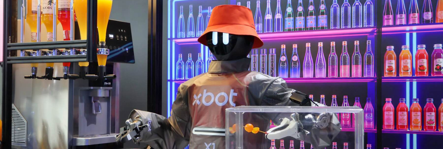 A humanoid robot showcases its cocktail making skills at the 2026 World Robot Conference in Beijing.
