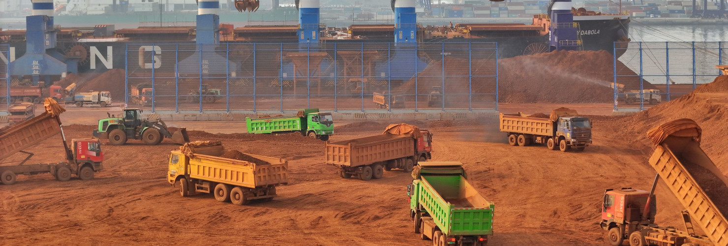 Trucks dump bauxite imported from Guinea into a pile at a ore dock in Yantai in eastern China's Shandong province, Wednesday, March 25, 2026. Bauxite smelters produce rare-earth elements (REEs) as a byâproduct, Credit:TANG KE / Avalon