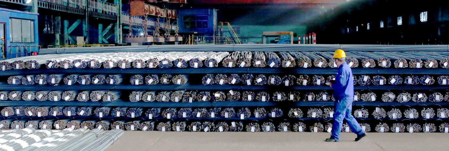 A technician inspects the quality of steel products to be delivered, Zhangjiakou City, Hebei Province, China