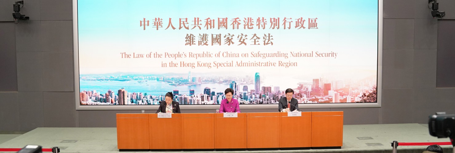 Chief Executive Carrie Lam (C), the Secretary for Justice Teresa Cheng (L) and the HKSAR government's Secretary for Security John Lee Ka-chiu attend a press conference in Hong Kong, July 1 2020