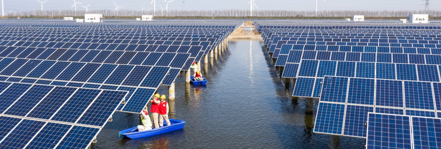 Power workers inspect photovoltaic power generation facilities at a 35-MEGAwatt "fish-light complementary" photovoltaic power station in Binhai, Jiangsu, March 15, 2022