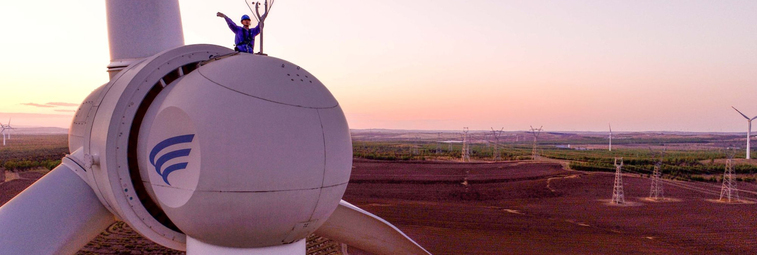 Aerial photo workers inspect equipment at a wind power photovoltaic field in Ulanhot, Hinggan League, Inner Mongolia, China, May 23, 2023