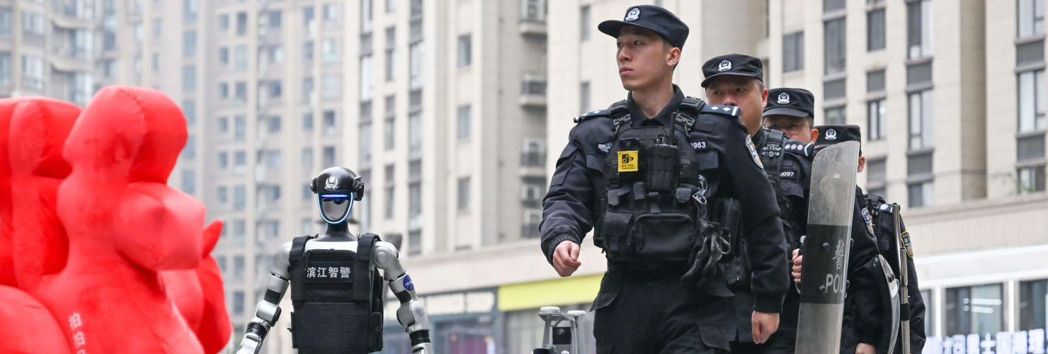 Police men and robots patrol in Hangzhou City, 13 February, 2026.