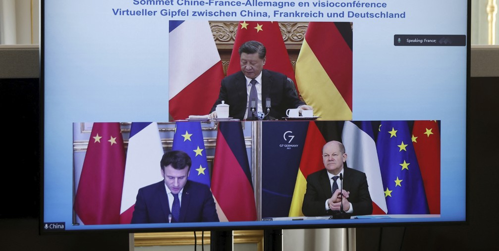 French President Emmanuel Macron, German Chancellor Olaf Scholz, below right, and Chinese President Xi Jinping, top, discussing the Ukraine crisis during a video-conference