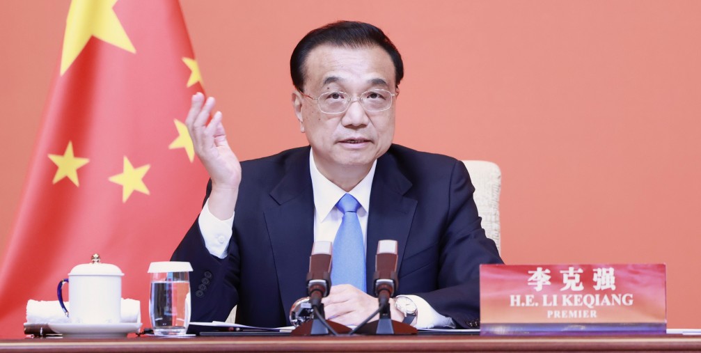 Chinese Premier Li Keqiang attends a symposium on the 70th anniversary of the China Council for the Promotion of International Trade in Beijing, capital of China, May 19, 2022