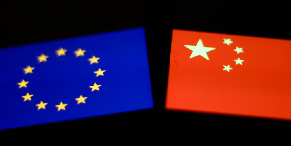 Flags of European Union and China displayed on screens
