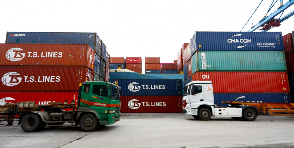 Cargoes and transport long vehicles are seen at a port in Keelung.