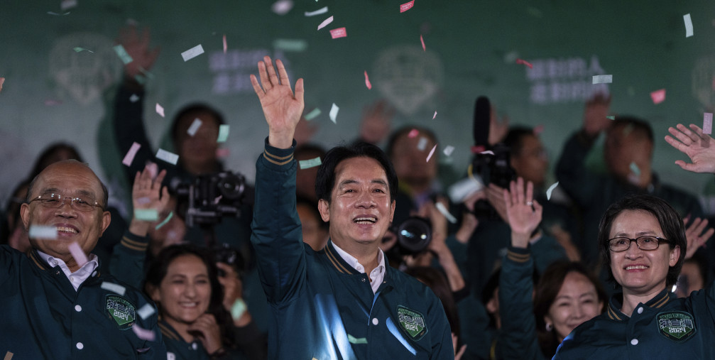Taiwanese Vice President Lai Ching-te, also known as William Lai, left, celebrates his victory with running mate Bi-khim Hsiao in Taipei, Taiwan, Saturday, Jan. 13, 2024. 