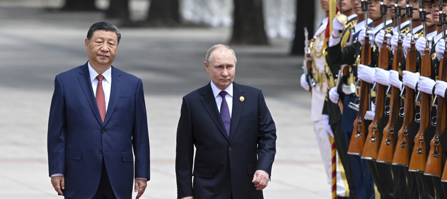 Chinese President Xi Jinping, left, and Russian President Vladimir Putin review the honor guard during an official welcome ceremony in Beijing, China, Thursday, May 16, 2024.