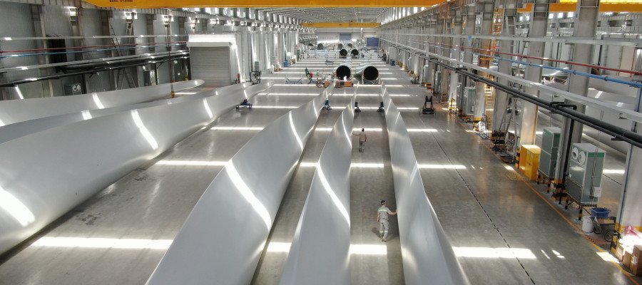 Employees inspect wind turbine blades at a workshop of Shanghai Aeolon Wind Energy Technologies Development (Group) Co Ltd. on May 13, 2020 in Nantong, Jiangsu Province of China.