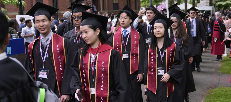 Students proceed through Harvard Yard during commencement ceremonies at Harvard University, Thursday, May 29, 2025, in Cambridge, Mass. 