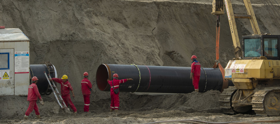 Workers labor at the construction site of the China-Russia east route natural gas pipeline in Hai'an in eastern China's Jiangsu province Saturday, March 12, 2022.